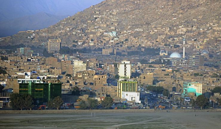 Urban landscape of Kabul with a mosque visible in the distance