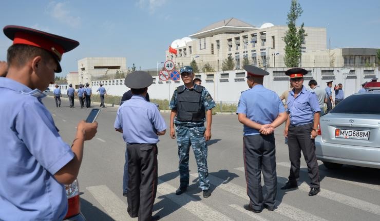 Police officers outside the Chinese embassy in Kyrgyzstan
