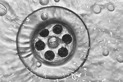 Water Flowing down a drain Water Flowing down a drain
