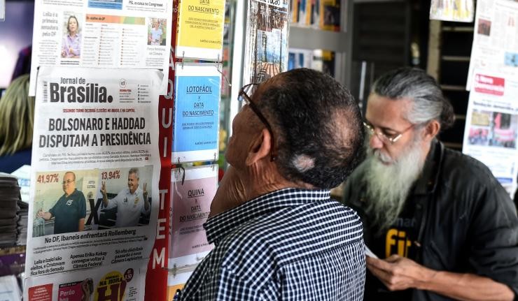Citizens reading Political Campaign posters in Brasilia Citizens reading Political Campaign posters in Brasilia