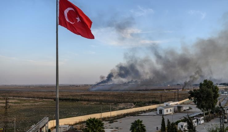 Shelling and Smoke behind a Turkish flag Shelling and Smoke behind a Turkish flag
