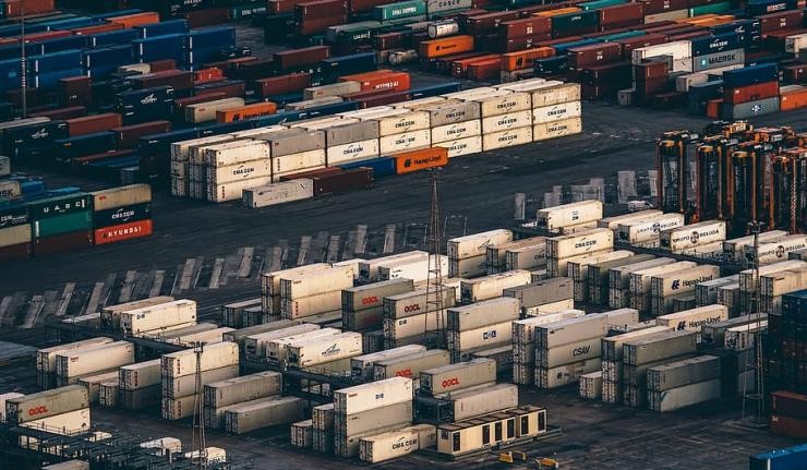 Stacked shipping containers at a port Stacked shipping containers at a port