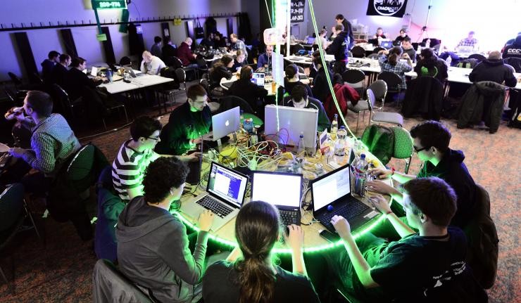 Coders participating in a hackathon Coders participating in a hackathon