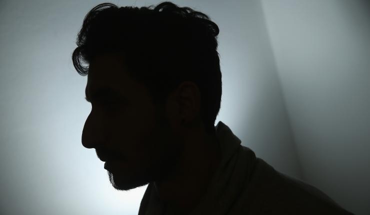 A silhouetted image of a man