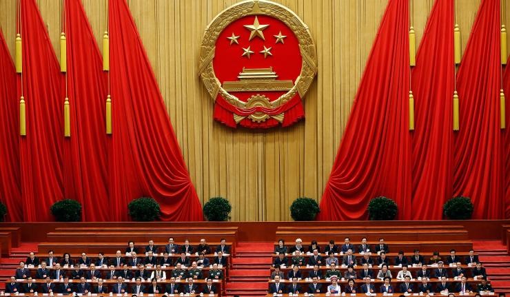 Officials of the communist party seated at the National People's Congress in Beijing Officials of the communist party seated at the National People's Congress in Beijing