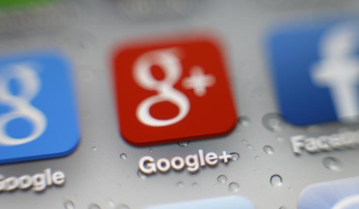 Extreme closeup of an iPhone screen with three apps visible - Google, Google+ and Facebook