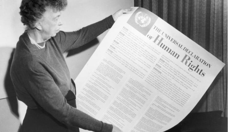 Woman holding up the Universal Declaration of Human Rights Woman holding up the Universal Declaration of Human Rights