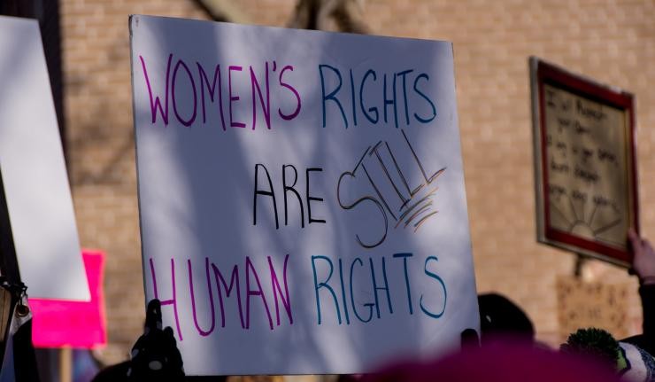 Protestor's poster which reads 'Women's rights are still human rights'