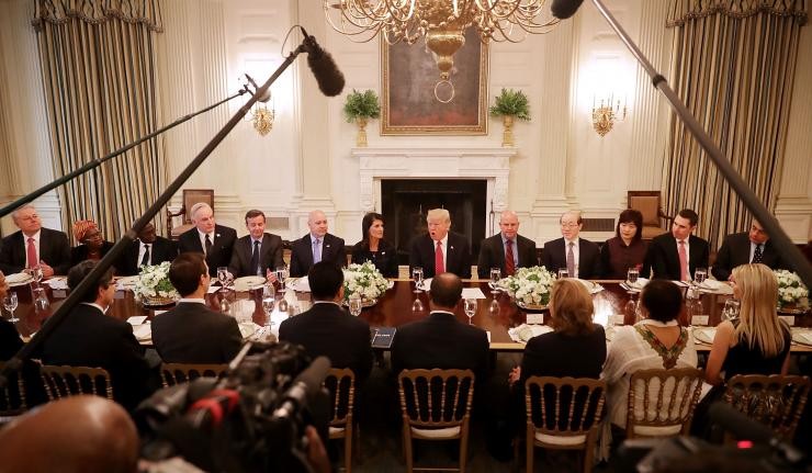 Donald Trump and his advisors seated around a table discussing the end to the JCPOA nuclear agreement with Iran Donald Trump and his advisors seated around a table discussing the end to the JCPOA nuclear agreement with Iran