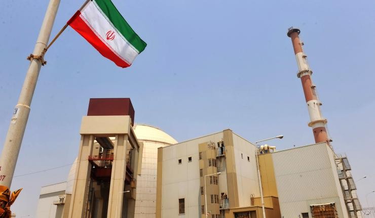 Iranian flag outside nuclear reactor at Bushehr plant