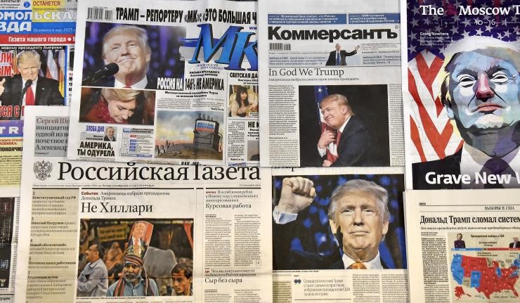 A collection of Russian newspapers with Donald Trump on every frontpage