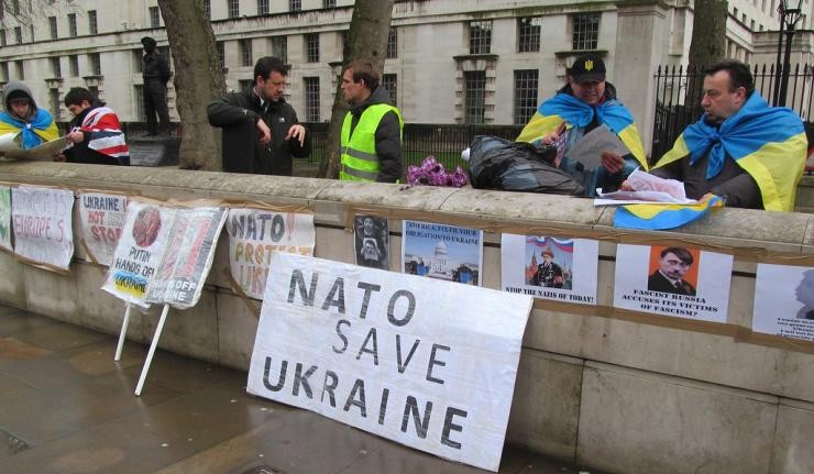 Posters in Ukraine reading 'NATO save Ukraine'