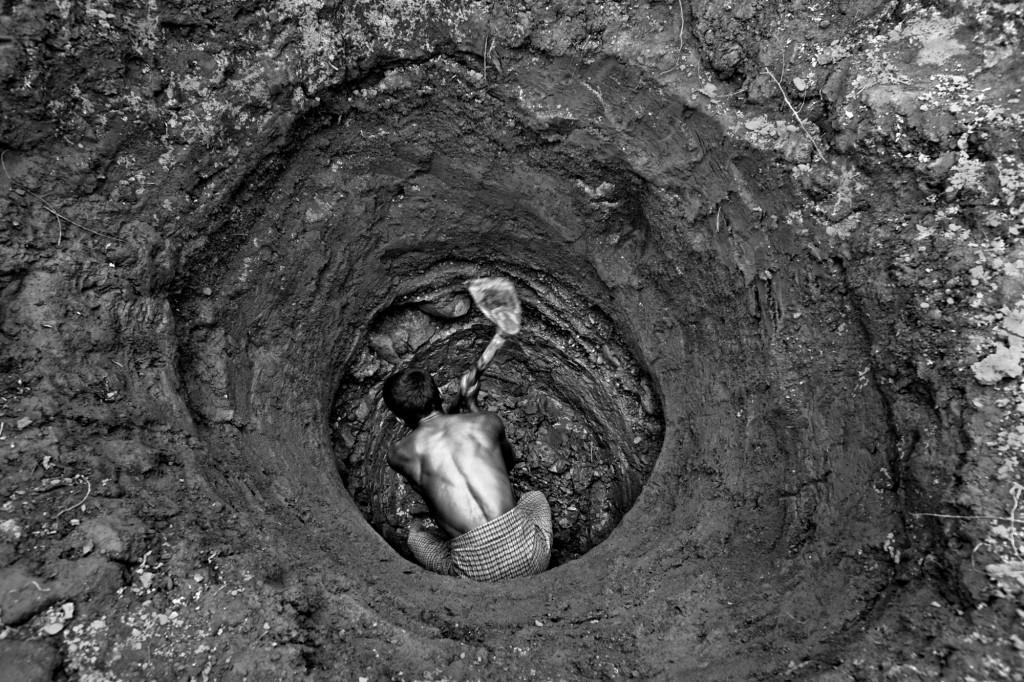 A man digging a well to get some fresh water—he has to dig deep. Ground water level is a major problem in and around the Nayapara camp. As a result, water supply is quite irregular in the camp. A man digging a well to get some fresh water—he has to dig deep. Ground water level is a major problem in and around the Nayapara camp. As a result, water supply is quite irregular in the camp.