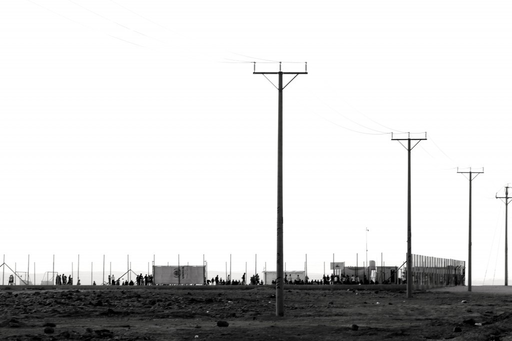 Fences along part of Za'atari camp. The camp's boundaries have been porous allowing people to leave under the cover of darkness. (Credit: Lucas de Abreu, October 2014)