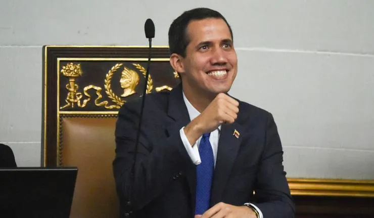 Juan Guaido againt a podium