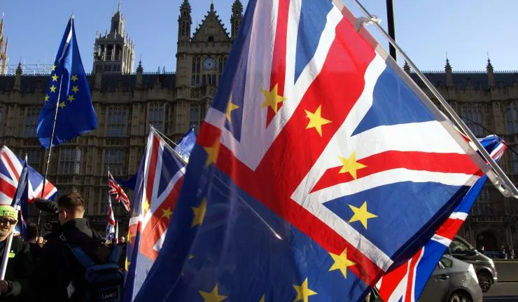 Protestor waiving a flag that's half union jack and half EU flag