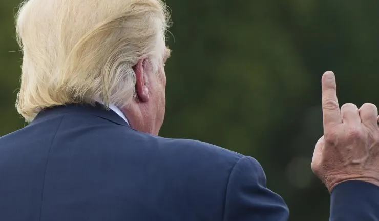 Back view of Donald Trump raising his index finger