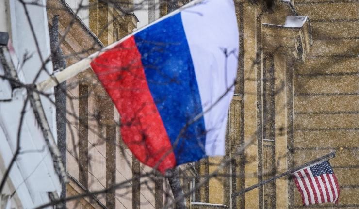 Russian flag and U.S. flag on adjacent building facades