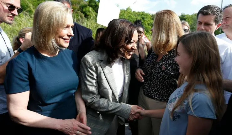 Prof Anita Hill shaking hands with a young girl