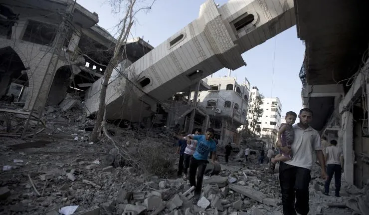 Dilapiated buildings and a collapsed tower in Syria