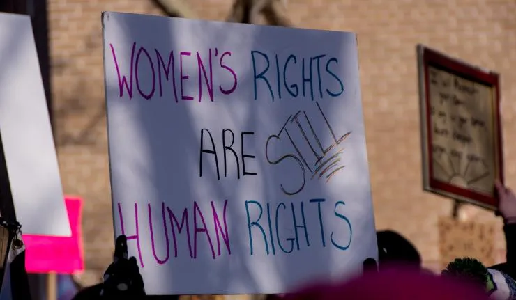 Protestor's poster which reads 'Women's rights are still human rights'