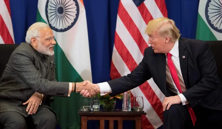 Donald Trump and Narendra Modi shaking hands