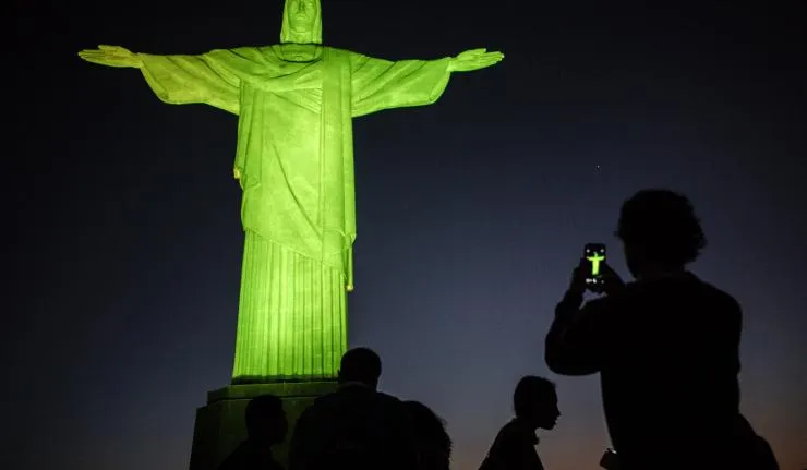 Christ the Redeemer lit at night