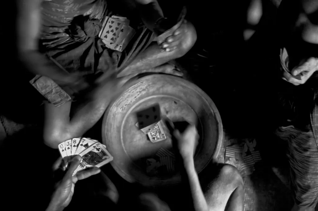 It is almost 40 degrees outside—the usual summer temperature in Bangladesh. Not much for the young lads of the camp to do except play cards to pass the time.
